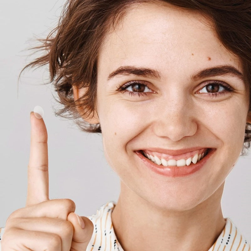 Woman using Vexo pimple patch